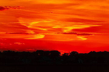 Summer sunset or sundowner view with a dramatic sky near Moos, Deggendorf, Bavaria, Germany