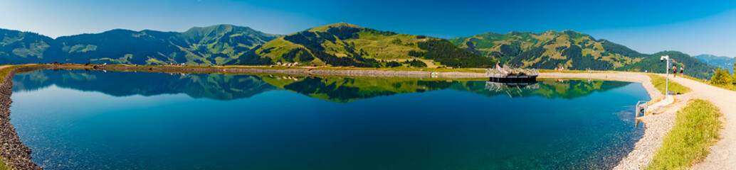 High resolution stitched alpine summer panorama with reflections at Lake Prinzensee, Mount Natrun,...