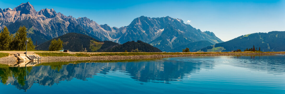 High resolution stitched alpine summer panorama with reflections at Lake Prinzensee, Mount Natrun, Maria Alm am Steinernen Meer, Salzburg, Austria