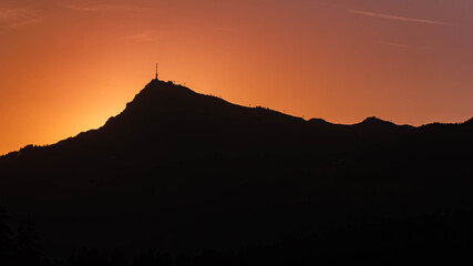 Alpine sunrise with Mount Kitzbueheler Horn at Lake Schwarzsee, Kitzbuehel, Tyrol, Austria