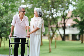 Senior Asian couple happy in park spending time together
