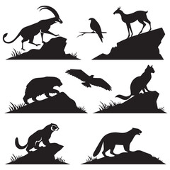 Collection of silhouetted wild animals including ibex eagle antelope bear fox and wolverine on rocky terrain