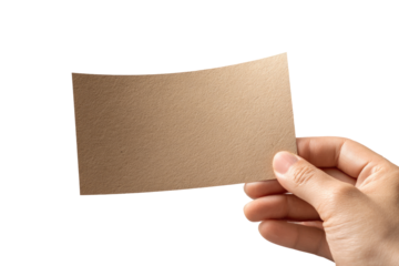 A hand holds a tan rectangular piece of paper