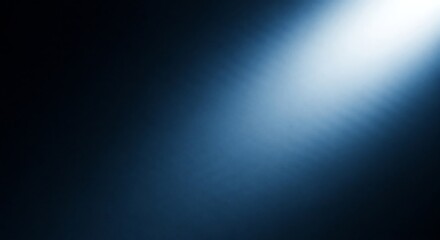 A single bright blue light beam shining diagonally from the top right corner on a dark, subtly textured background