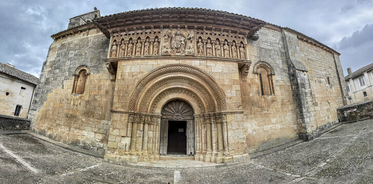 Ornate Romanesque facade of San Juan Bautista Church in Moarves de Ojeda