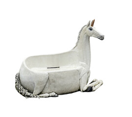 Enchanted unicorn sculpture as a whimsical bathtub in a charming garden setting