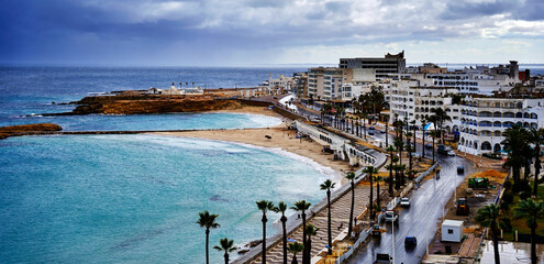 Promenade and road overlooking picturesque coastline in monastir, tunisia