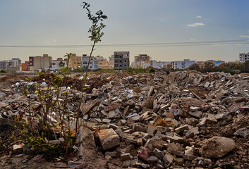 Heaps of rubble and garbage polluting suburban settlement in north africa © Frank