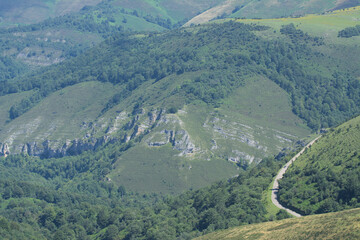 Road winds through forests and limestone peaks in Cordel - Discover the winding road that curves...