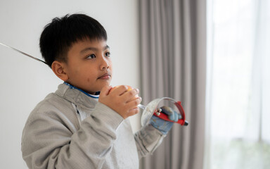 A girl in fencing gear with their mother preparing fruit and sports equipment