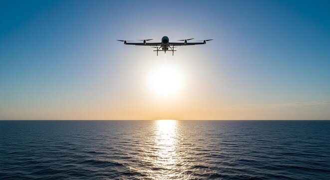Drone flying over ocean at sunset with clear skyairplane in the sky
