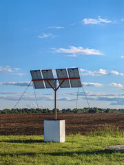 Solar panels on a field, promoting renewable energy and environmental consciousness.