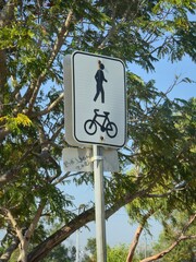 pedestrian crossing sign on blue sky