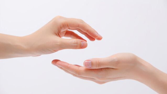 Close up of two human hands interacting with one hand offering something to the other on a white background - Powered by Adobe