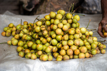 Many sour fruits on a sack in the street market