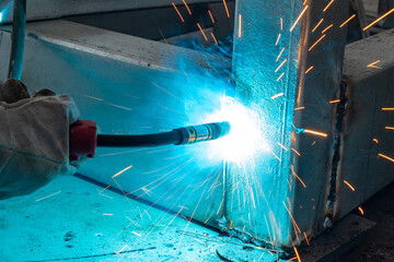 worker welding in a factory at horizonal composition