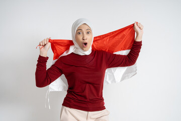 Cheerful woman holding and celebrating with the Indonesia flag, showcasing patriotism and pride...