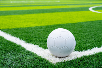 a soccer on the corner on a soccer field at horizontal composition