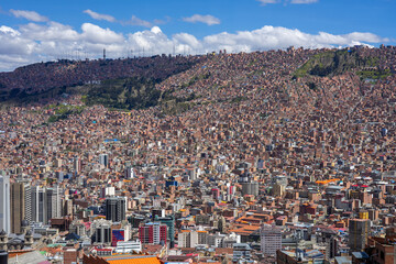 Aerial view of La Paz city sprawling across mountainous terrain with dense urban development...