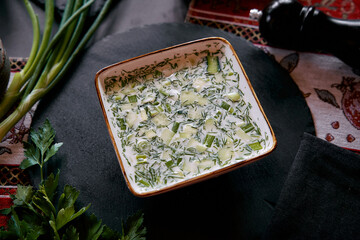 A Delicious Bowl of Fresh Cucumber and Herb Soup Ideal for Summer Days Perfectly Blended with...