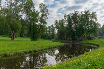 Slavyanka River Valley in the landscape part of the Pavlovsk Palace and Park Complex on a sunny summer day, Pavlovsk, Saint Petersburg, Russia