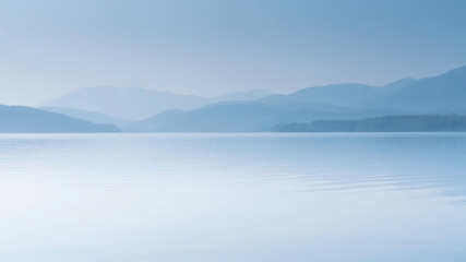Calm Lake with Hazy Mountains in the Background