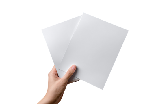 A hand holds two blank white sheets of paper