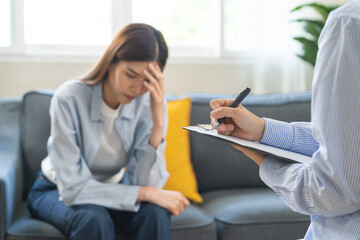 Psychology, depression. Suffer asian young woman consultation with psychologist while patient...