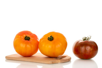 Juicy fresh tomatoes isolated on white background, close-up.