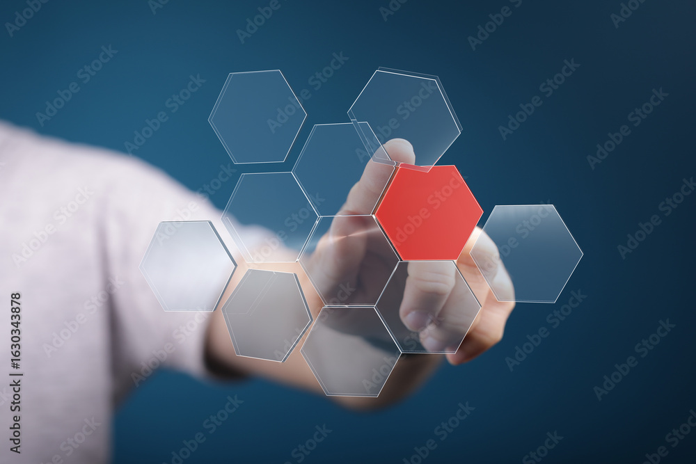 Aufkleber person interacts with a transparent hexagonal interface, selecting a red hexagon. technology, innova