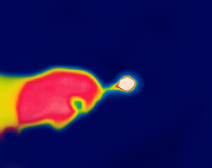 Burning cigarette in hand, night smoking, Image from thermal imager device. Medium wave infrared spectrum