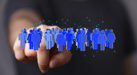 Image depicting a hand interacting with a network of diverse digital people, symbolizing online...