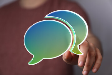 Abstract image of speech bubbles, representing online chat, communication, dialogue, and social media.