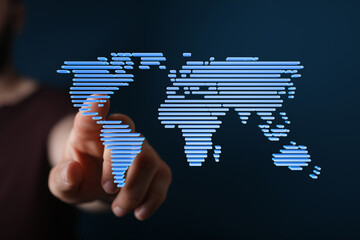 Person interacts with a digital world map, representing global connectivity and networking.