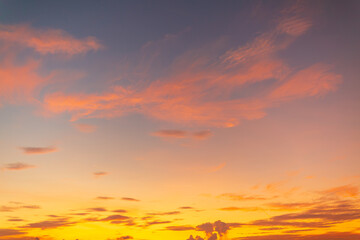 Colorful sky and clouds backdrop in the morning,Beautiful Vivid sky painted by the sun leaving bright golden shades.