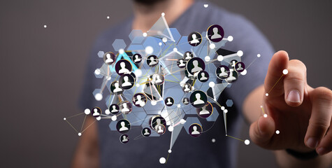 Person interacting with a digital network visualization.  Social media, connections, global network.