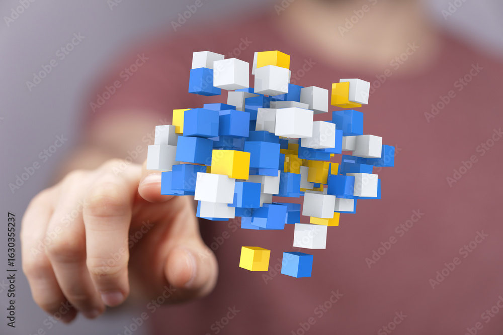 Poster abstract image of hand interacting with colorful data cubes, symbolizing innovation and technology.