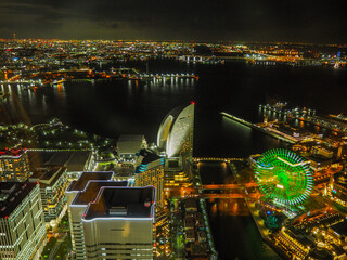 Night view of Minato Mirai in Yokohama with illuminated Ferris wheel and bay area