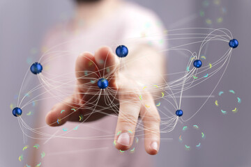Abstract image of a hand connecting digital nodes, symbolizing global networking, connectivity, and...