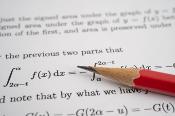 Pencil on mathematic formula exercise test paper in education school.