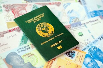 Nigerian naira currency money bills and passport. The concept of travel and vacation