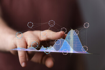 Hand interacting with a holographic graph.  Data analysis, business intelligence, technology.