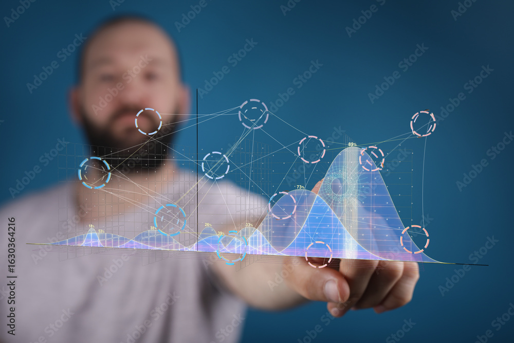 Aufkleber stock photo of a man interacting with a digital graph, showcasing data analysis and technology.
