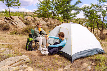 Fototapeta premium Camping adventures with friends in nature enjoying skills of outdoor living