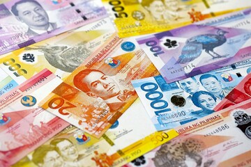 Philippines peso currency money bills. The current banknotes lies on table in big amount
