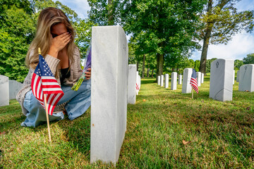 Kneeling in Sorrow: A Bride's Silent Tribute at a Military Cemetery