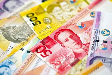 Philippines peso currency money bills. The current banknotes lies on table in big amount