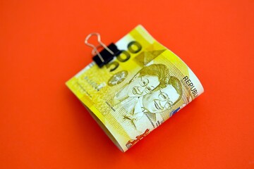 Philippines peso money bills in big amount on red. Finance and banking concept