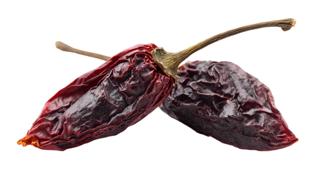 Two dried ancho chili peppers isolated on transparent background