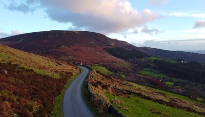 Winding road through autumnal hills